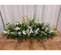 Raquette de fleurs deuil