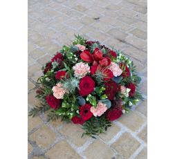 Coussin rond tons rouge 